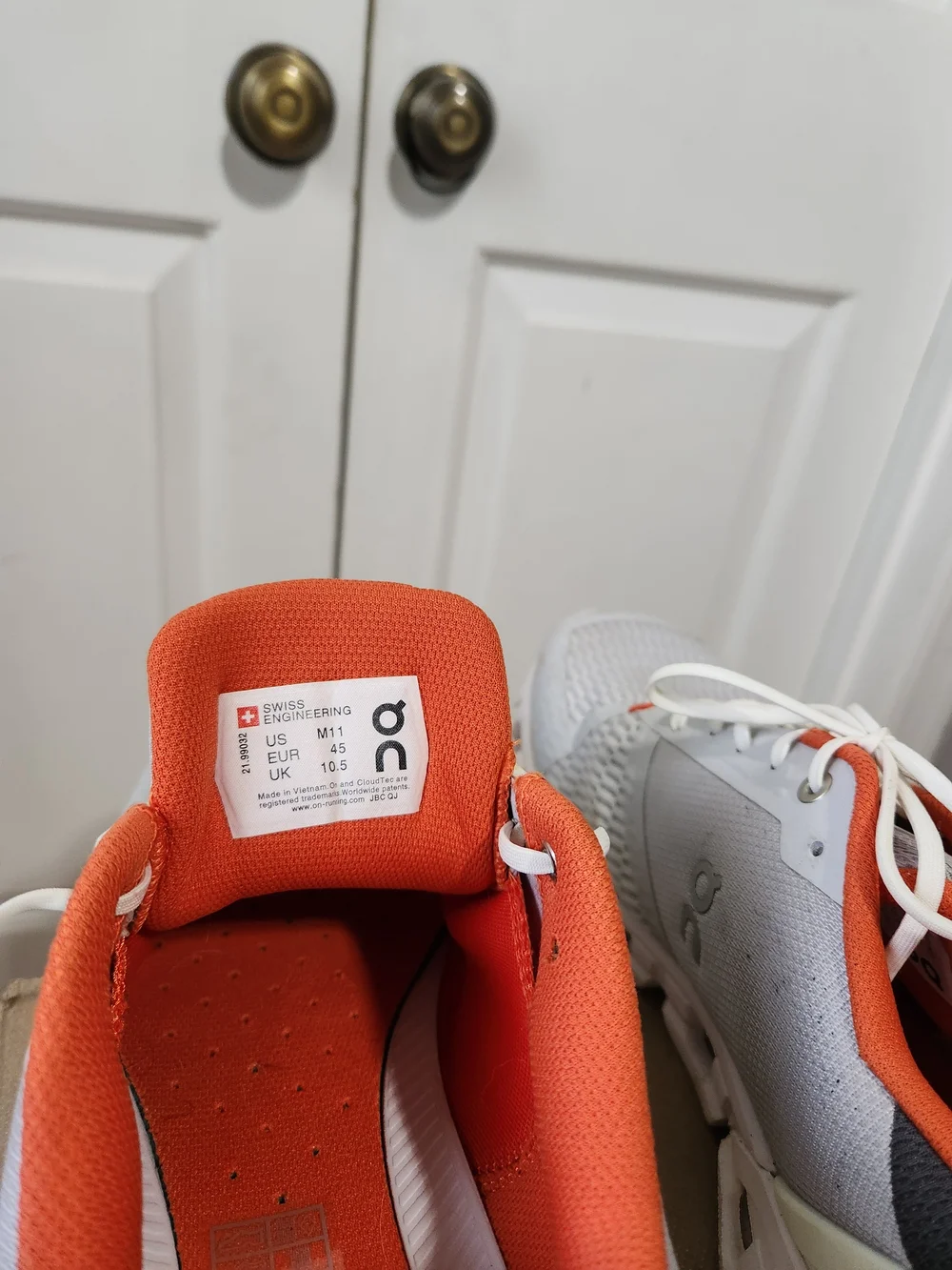 On Running Men’s White and Orange Cloudswift Running Shoes